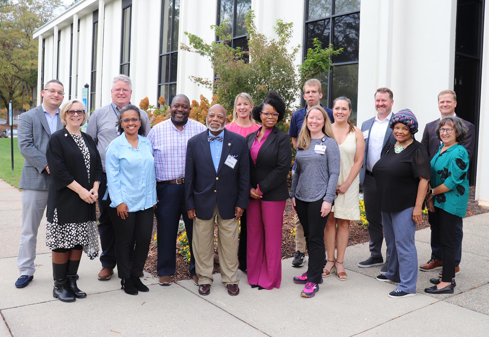 Group portrait of SRC members standing with Kathy Hayfield, the DARS Commissioner, outside of the Department for Aging and Rehabilitative Services (DARS) Lee Building in Henrico, VA.